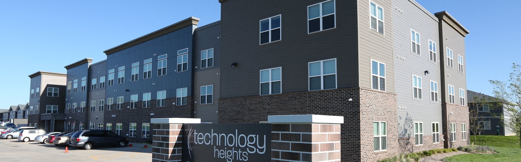 Technology Heights Exterior with Sign and Grass